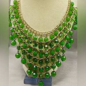 5 strand tiered green beaded bib style chain necklace. Dangle beads. Gold tone